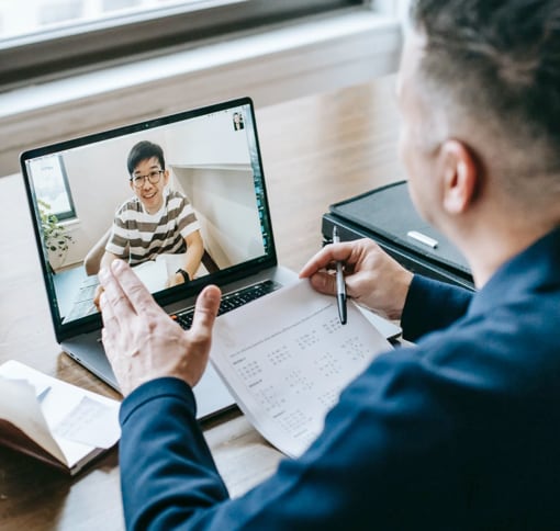 Two men having a meeting through video chat